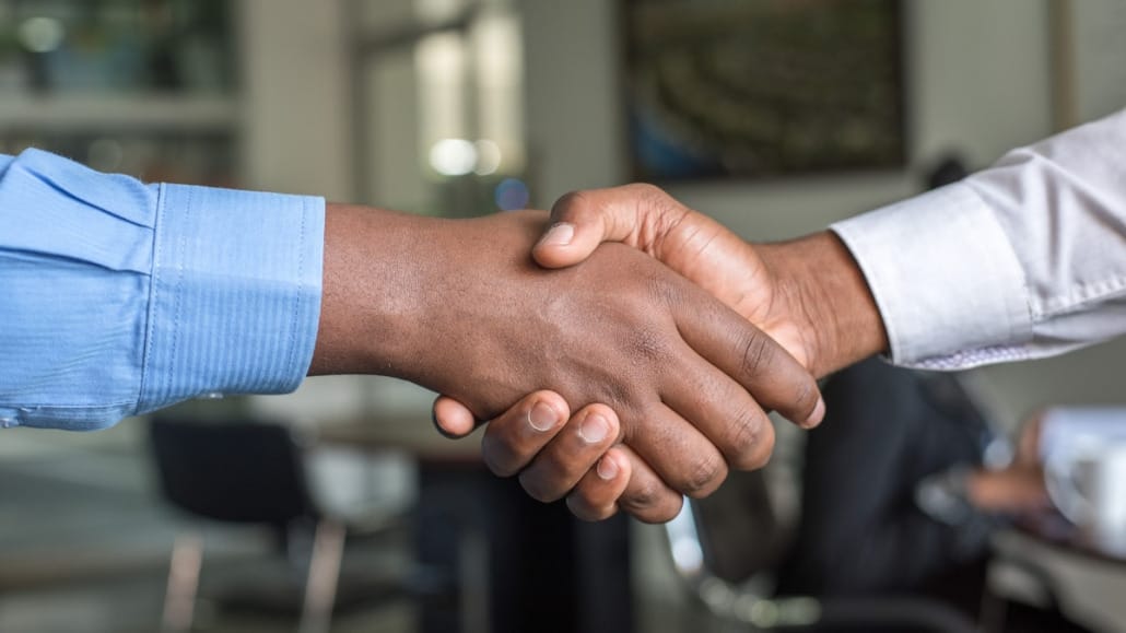 Handshake between an executive and a recruiter