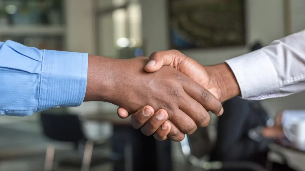 Handshake between an executive and a recruiter