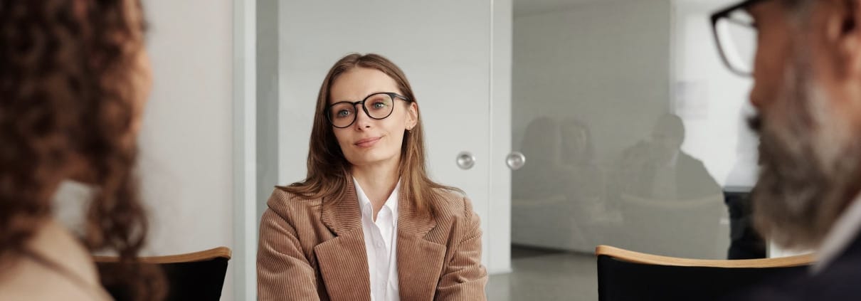 Executive interview candidate holding the attention of a two-person senior panel